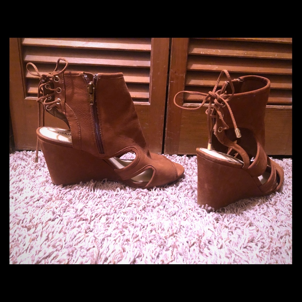 Open toed wedges that tie in the back.